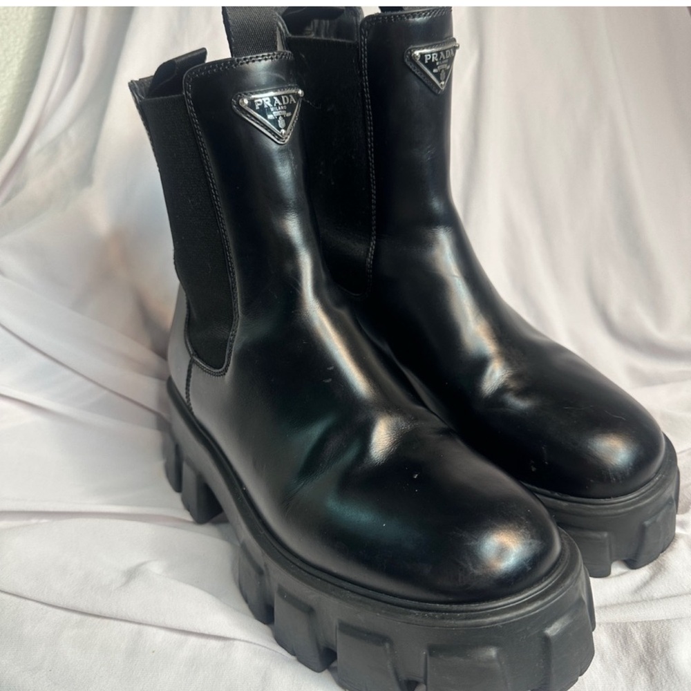 Monolith brushed leather Chelsea boots combats boots from Prada.